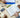 Study aids such as books, pens, note pads, and calculator on table with students' hands, photographed from above
